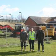 L-R Cllr Rob Adams, club secretary Patrick Twist and chairman of South Lenches Parish Council Chris Seabourne in front of the construction site at the Lenches Sports and Recreation Club