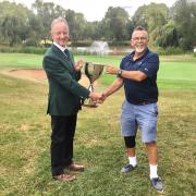 Seniors Section captain Brian Bunn presents Ed Mountney with the 2022 Senior Club Championship trophy