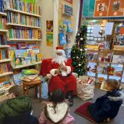 Father Christmas is hosting storytimes at Oxfam Evesham in the run-up to the big day