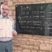 White Hart Royal General Manager Bill Ramsay is pictured with the restaurant menu.