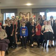 The TDMS Show Choir performed festive carols for Austen Court Care Home residents