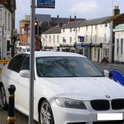 Cars parked on pavements in Evesham.