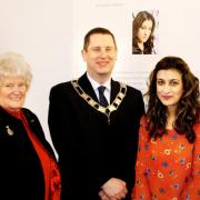 Photographer Sheeba Saeed at Evesham Library with Diana Raphael and her son Robert, deputy mayor of Evesham