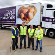 From left are Darren Smith (Scott Farms International), Jonathan Kelly (Spiers & Hartwell), Stan Smith (Scott Farms International) and Simon Hobbs (Scott Farms International) with one of the new Love Sweet Potatoes lorries.