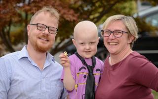 Four-year-old Drew Howard-Carter with mum and dad, Su and Jason
