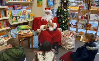 Father Christmas is hosting storytimes at Oxfam Evesham in the run-up to the big day