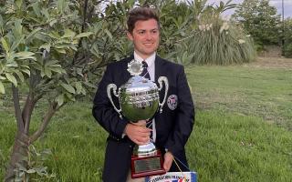 Luke Russell with his trophy and medal after winning the World Compak Clay Shooting Championships in Pschana, Greece